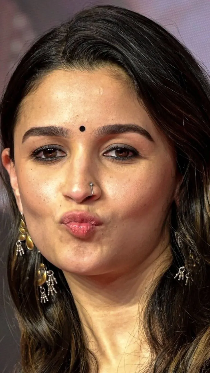Close-up portrait of Alia Bhatt making a pout face with a bindi and nose ring